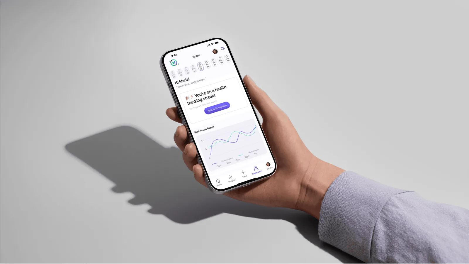 A hand holding a phone showing the VitalLoop home screen: Hi Maria, how are you feeling today, a health tracking streak card with an Add a Symptom button, and a Mini Trend Graph.